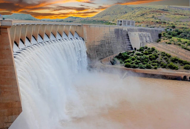 Aerial view of a large dam at sunset